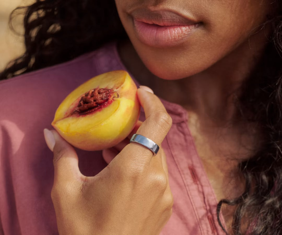 Silver Auro Ring 5 worn while holding fruit