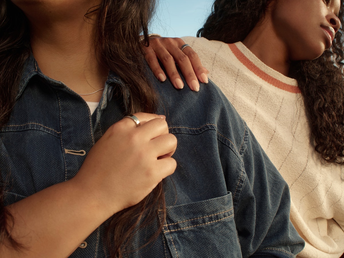 Two people standing side by side outdoors while wearing Auro Rings