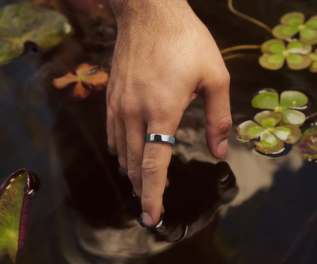 Silver Auro Ring 5 worn beside water