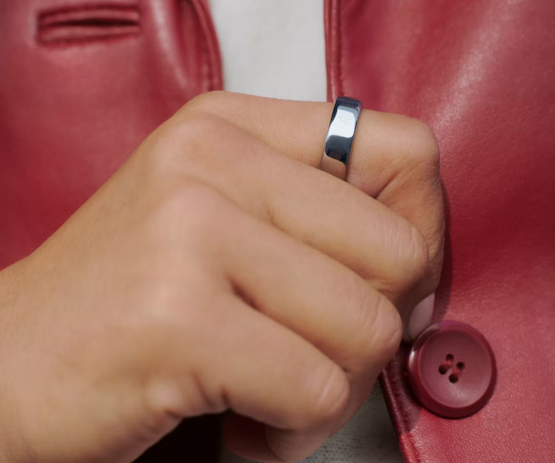 Silver Auro Ring 5 worn with a red jacket